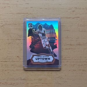 2025 Panini NFL Optic Football Lamar Jackson Uptown Insert No. 13, RARE INSERT